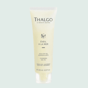 Tue d'huile-en-gel Thalgo en plastique jaune avec bouchon en plastique transparent, sur fond vert